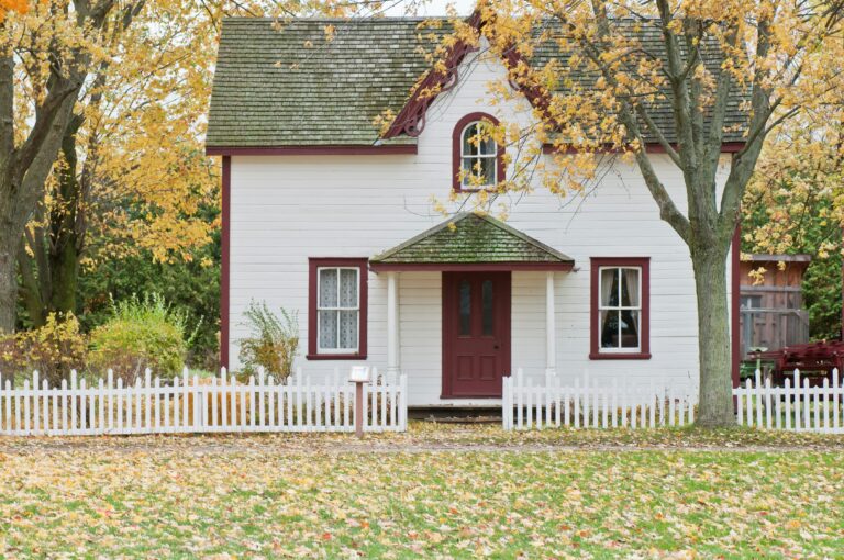a white house with a red door
