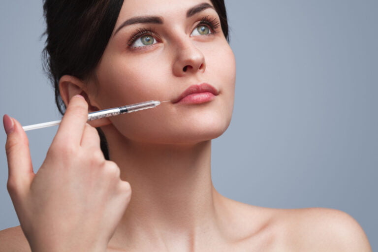 Woman receiving Botox injection, non-surgical cosmetic procedure for facial rejuvenation.