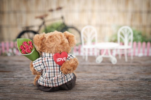 a teddy bear sits on a table