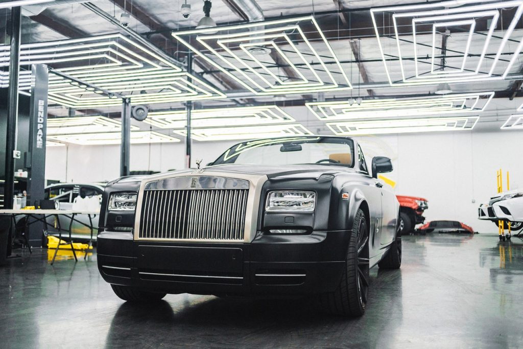 a black car in a warehouse