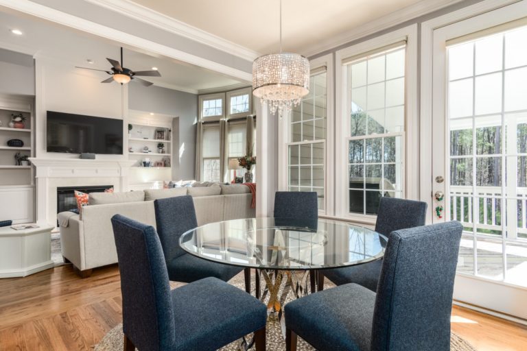 a living room with a table and chairs