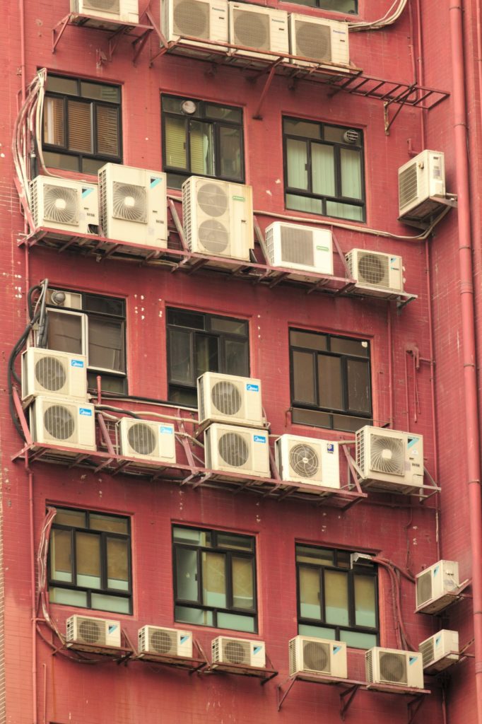 a pink building with many windows