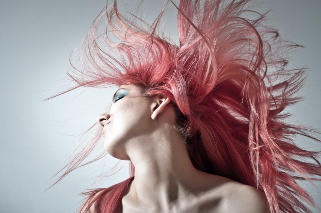 a woman with pink hair