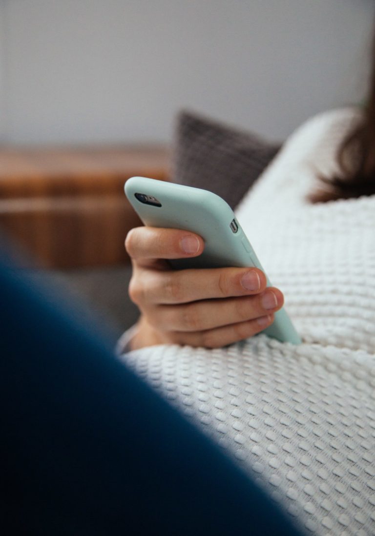 a hand holding a phone