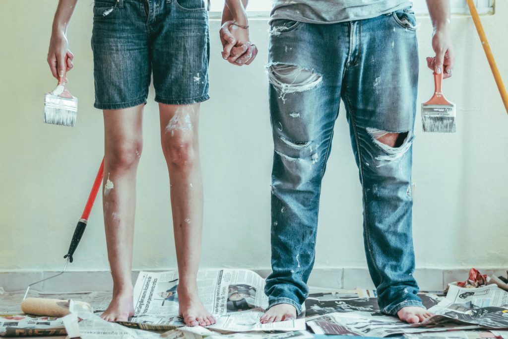 a man and a woman standing on a floor