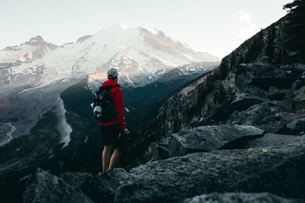 a man standing on a rocky cliff