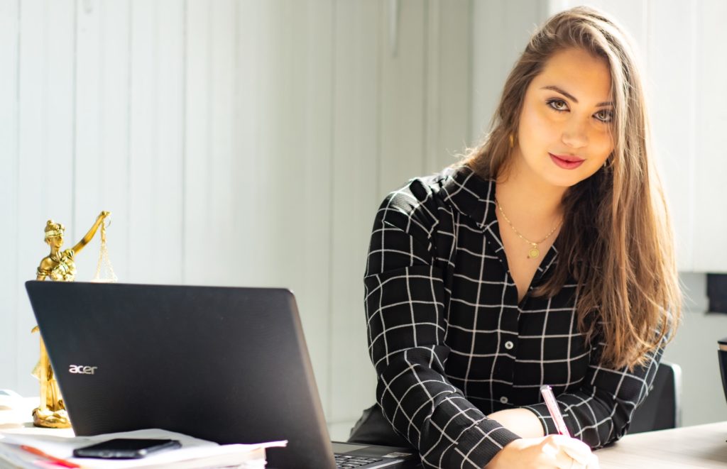 a woman sitting at a desk