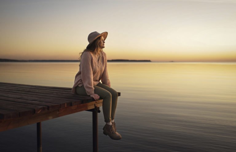 a person sitting on a bench