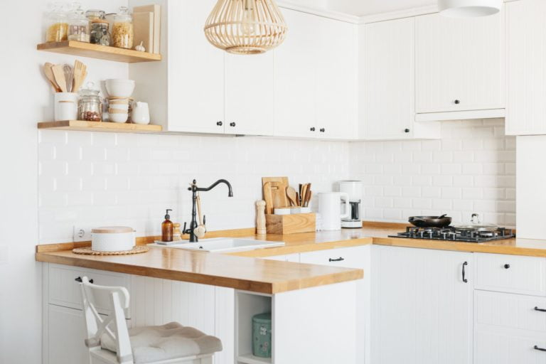 a kitchen with white cabinets