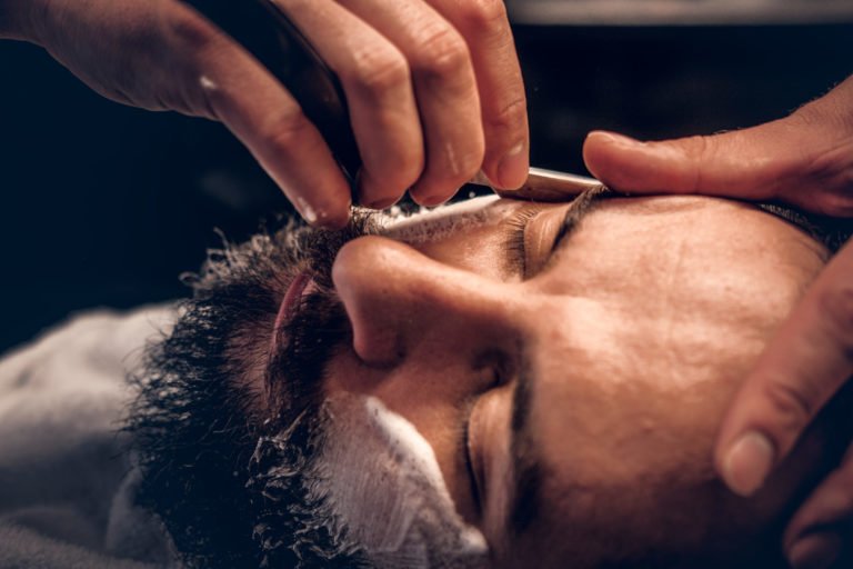 a person getting a haircut