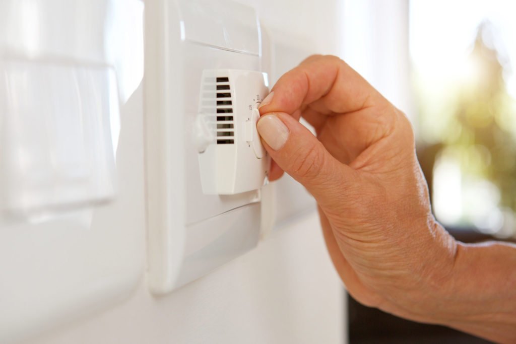 a close-up of a hand opening a door