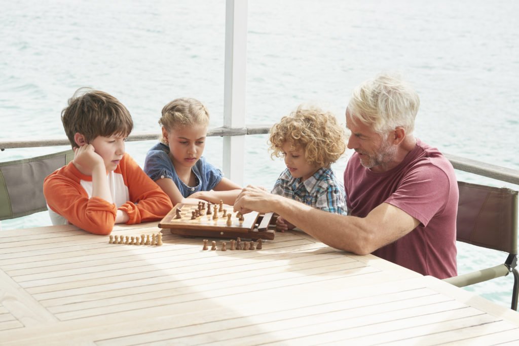 a group of kids playing chess