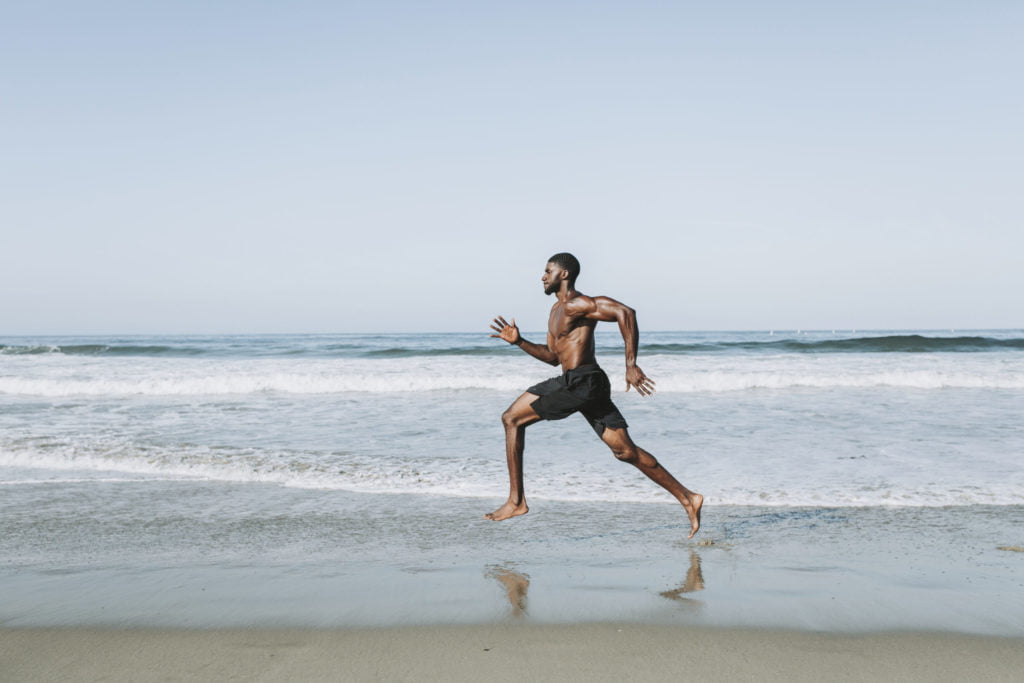 a man running on a beach