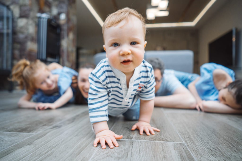 a baby crawling on the floor