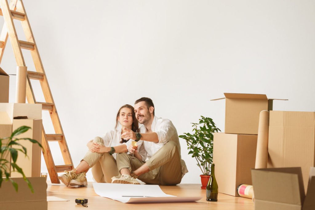 a man and woman sitting on a couch