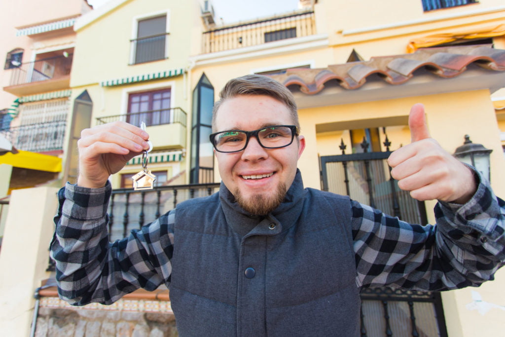 a man holding up a peace sign