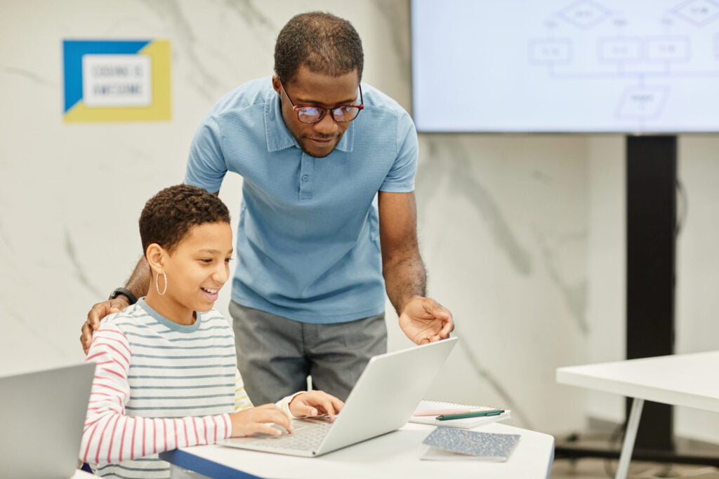 life advice, african american teacher helping student in class utc scaled