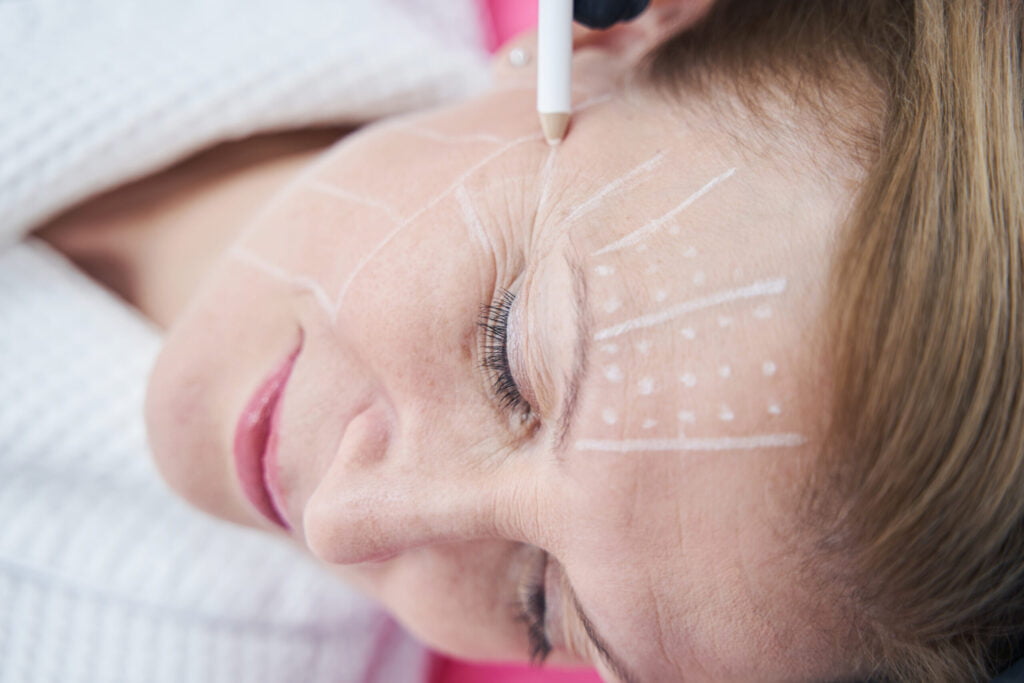 life advice, beautician drawing line on woman face with white p utc scaled