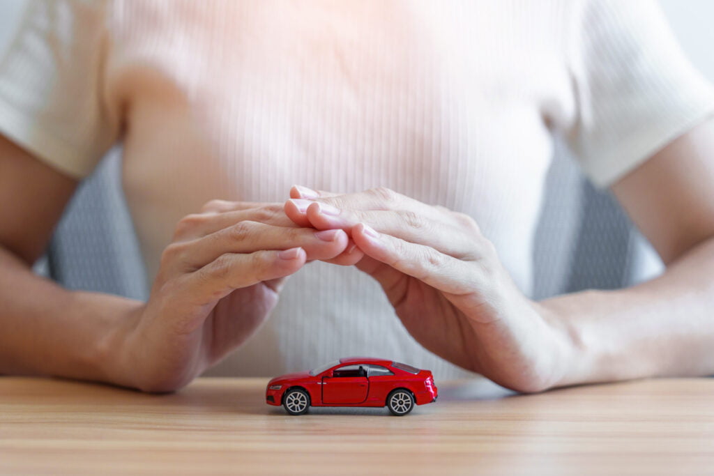 life advice, hand cover or protection red car toy on table utc scaled