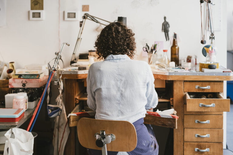 uncategorized, rear view of female jeweller working at workbench utc scaled